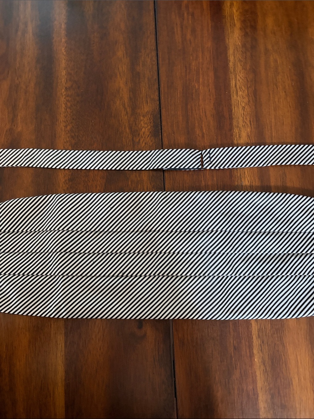 Collared Greens cummerbund and bow tie set. 100% silk traditional black stripe